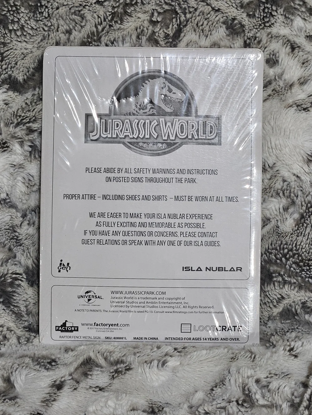 Jurassic World Loot Cate Metal Sign